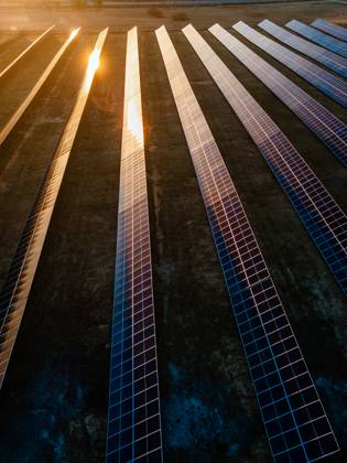 Aerial view of industrial sized solar panel farm during sunset, illustrating the blend of technology and nature Aerial view of industrial sized solar panel farm during sunset, illustrating the blend of technology and nature, 64453348.jpg RECORD DATE NOT STATED