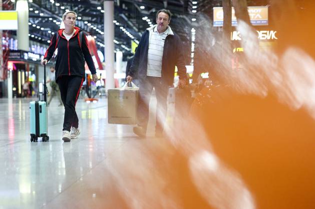 RUSSIA, MOSCOW REGION - SEPTEMBER 17, 2025: A woman wheels along her suitcase at Sheremetyevo International Airport. Sofya Sandurskaya TASS  84064015
