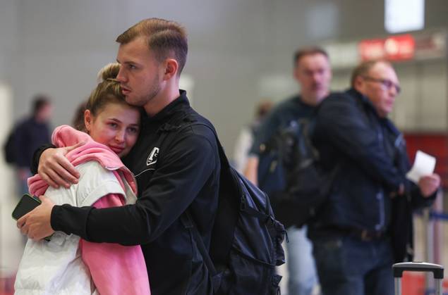 RUSSIA, MOSCOW REGION - SEPTEMBER 17, 2025: Young people share a hug at Sheremetyevo International Airport. Sofya Sandurskaya TASS  84063949