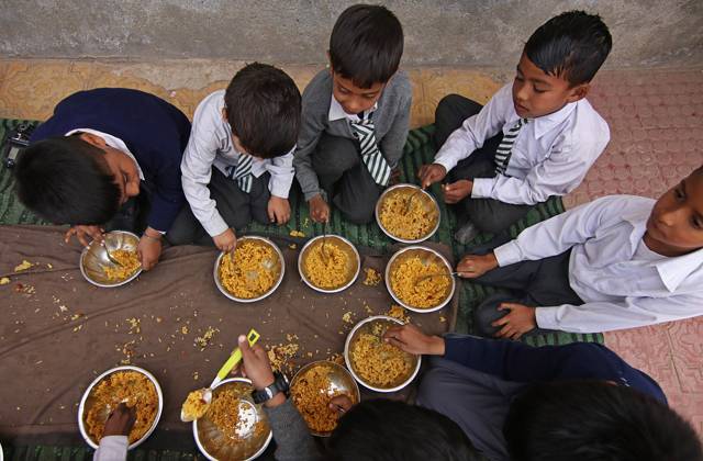World Food Day in India SRINAGAR,KASHMIR, INDIA-OCTOBER 15 : Schools children are pictured for the World Food Day as they eat Mid Day Meal (MDM) at a government school in Srinagar,Kashmir on October 15, 2022.The Mid Day Meal (MDM) in line with World Food Day 2022 theme Leave No One Behind is a wholesome freshly cooked lunch served to children in government and government-aided schools (upto 8th standard) in India to better the nutritional standing of under privileged schools-age children nationwide.The World Food Day 2022 themed as Leave No One Behind is observed annually on 16 October to highlight the millions of people worldwide who cannot afford a healthy diet and the need for regular access to nutritious food. Pakistan World. Editor  Copyright: x2025xAnadoluxFaisalxKhanx