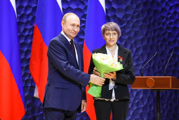 RUSSIA, KRASNODAR REGION - OCTOBER 3, 2025: Russia s President Vladimir Putin (L) awards a Badge of Distinction For Mentoring to Tatyana Timkina, a veteran of the All-Russian Public Organisation of Veterans (Pensioners) of War, Labour, the Armed Forces of the Russian Federation, and Law Enforcement Agencies for the Omsk Region, during a ceremony to award mentors and teachers of participants in the special military operation on Teacher s Day in the Sirius Federal Territory. Mikhail Metzel Russian Presidential Press and Information Office TASS  84545253