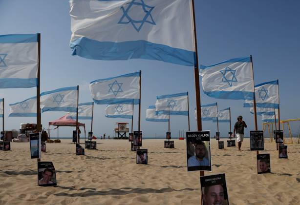 October 7, 2025, Rio De Janeiro, Rio De Janeiro, Brazil: Rio de Paz, a Brazilian human rights NGO known for its symbolic public demonstrations installed 22 Israeli flags and photos of 48 hostages on Copacabana Beach in a demonstration against terrorism and in solidarity with the victims of the Hamas attack on October 7, 2023, marking two years since the attacks on Israel. The act denounced terrorism and called for the release of hostages still held in Gaza. Rio De Janeiro Brazil - ZUMAk251 20251007_znp_k251_004 Copyright: xBobxKarpx