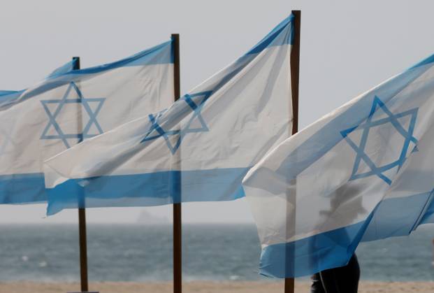 October 7, 2025, Rio De Janeiro, Rio De Janeiro, Brazil: Rio de Paz, a Brazilian human rights NGO known for its symbolic public demonstrations installed 22 Israeli flags and photos of 48 hostages on Copacabana Beach in a demonstration against terrorism and in solidarity with the victims of the Hamas attack on October 7, 2023, marking two years since the attacks on Israel. The act denounced terrorism and called for the release of hostages still held in Gaza. Rio De Janeiro Brazil - ZUMAk251 20251007_znp_k251_010 Copyright: xBobxKarpx