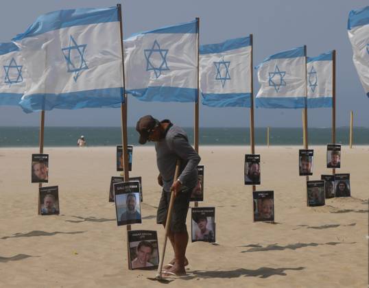 October 7, 2025, Rio De Janeiro, Rio De Janeiro, Brazil: Rio de Paz, a Brazilian human rights NGO known for its symbolic public demonstrations installed 22 Israeli flags and photos of 48 hostages on Copacabana Beach in a demonstration against terrorism and in solidarity with the victims of the Hamas attack on October 7, 2023, marking two years since the attacks on Israel. The act denounced terrorism and called for the release of hostages still held in Gaza. Rio De Janeiro Brazil - ZUMAk251 20251007_znp_k251_015 Copyright: xBobxKarpx