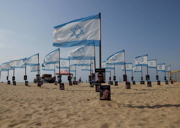 October 7, 2025, Rio De Janeiro, Rio De Janeiro, Brazil: Rio de Paz, a Brazilian human rights NGO known for its symbolic public demonstrations installed 22 Israeli flags and photos of 48 hostages on Copacabana Beach in a demonstration against terrorism and in solidarity with the victims of the Hamas attack on October 7, 2023, marking two years since the attacks on Israel. The act denounced terrorism and called for the release of hostages still held in Gaza. Rio De Janeiro Brazil - ZUMAk251 20251007_znp_k251_002 Copyright: xBobxKarpx