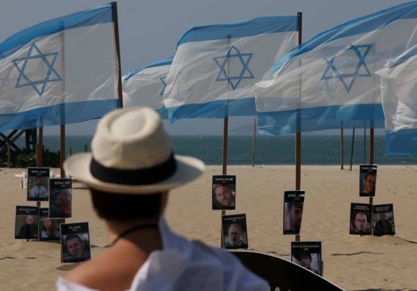 October 7, 2025, Rio De Janeiro, Rio De Janeiro, Brazil: Rio de Paz, a Brazilian human rights NGO known for its symbolic public demonstrations installed 22 Israeli flags and photos of 48 hostages on Copacabana Beach in a demonstration against terrorism and in solidarity with the victims of the Hamas attack on October 7, 2023, marking two years since the attacks on Israel. The act denounced terrorism and called for the release of hostages still held in Gaza. Rio De Janeiro Brazil - ZUMAk251 20251007_znp_k251_016 Copyright: xBobxKarpx