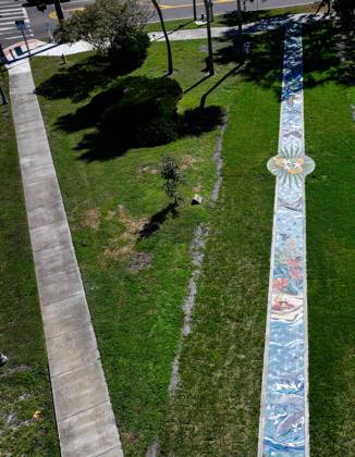 October 13, 2025, St. Petersburg, Florida, USA: An aerial drone view of The Sunshine City Mosaic sidewalk mural at Sunset Park, 7340 Central Ave, on Monday, Oct. 13, 2025 in St. Petersburg. The 175 foot long side walk mural is the largest in the Southeast. St. Petersburg USA - ZUMAs70_ 20251013_zan_s70_047 Copyright: xDirkxShaddx