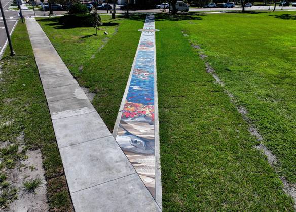 October 13, 2025, St. Petersburg, Florida, USA: An aerial drone view of The Sunshine City Mosaic sidewalk mural at Sunset Park, 7340 Central Ave, on Monday, Oct. 13, 2025 in St. Petersburg. The 175 foot long side walk mural is the largest in the Southeast. St. Petersburg USA - ZUMAs70_ 20251013_zan_s70_046 Copyright: xDirkxShaddx