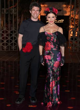 Max Greenfield and Tess Sanchez attend the 2025 Dia De Muertos Gala Presented by Lexus, Tequila Don Julio, Nike, DNERO, Calamigos Ranch and Maremoto at the Los?Angeles? River?Center?&?Gardens in Los Angeles on Thursday, October 30, 2025.  LAP20251030094 GREGxGRUDT