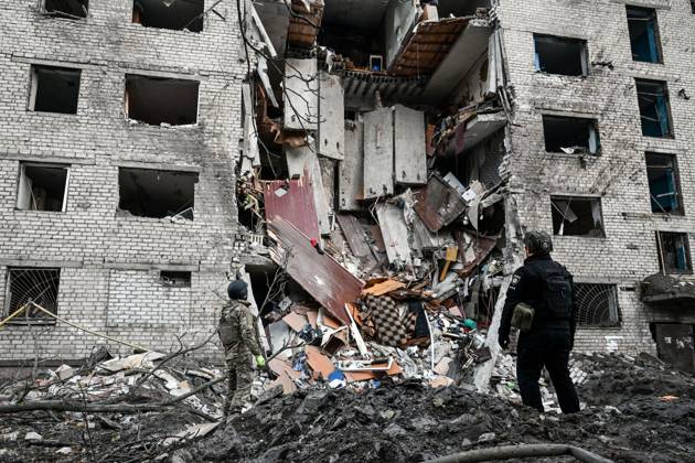National Police officers examine the place of impact of a Russian missile outside a hostel, destroyed by an overnight Russian missile and drone attack, Zaporizhzhia, Ukraine, October 30, 2025. Russian troops launched eight missiles and 20 drones at the southeastern Ukrainian city, killing two people and injuring 23. At least 12 apartment blocks were damaged, and a hostel was destroyed, where several floors collapsed. (Photo by Dmytro Smolienko Ukrinform) Zaporizhzhia hostel destroyed by Russian missile and drone strike  Copyright: xDmytroxSmolienkox