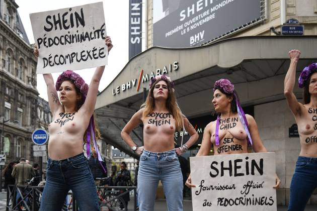 Protest Against Shein in Front of BHV Marais - Paris Femen activists hold placards reading Shein, unapologetic pedophile supplier - Shein official supplier of paedocriminals during a protest outside the BHV Le Marais store to denounce the opening of a boutique by Chinese brand Shein, accused of selling sex dolls modelled on children, in Paris, France, on November 3, 2025. Photo by Florian Poitout ABACAPRESS.COM Paris France  Copyright: xPoitoutxFlorian ABACAx