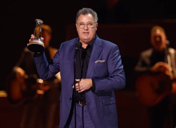 Vince Gill accepts the Lifetime Achievement Award onstage during the 59th CMA Awards at the Bridgestone Arena in Nashville, Tennessee, on Wednesday, November 19, 2025.  NAS20251119361 JOHNxANGELILLO