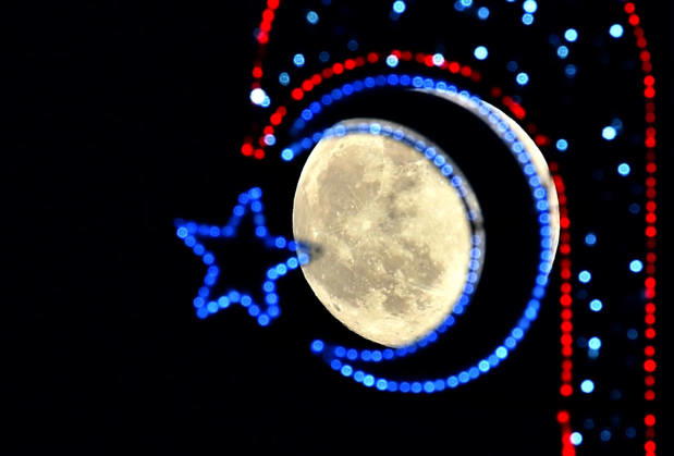 Full moon rises over Kars, Turkiye KARS, TURKIYE - DECEMBER 4: The full moon is seen behind a Turkish flag shaped light in Sarikamis district of Kars, Turkiye on December 4, 2025. Huseyin Demirci Anadolu Kars Turkey. Editorial use only. Please get in touch for any other usage.  Copyright: x2025xAnadoluxHuseyinxDemircix