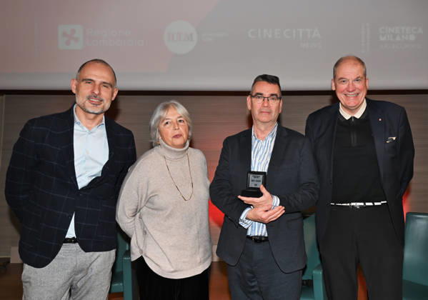 Milan, Italy Mick Herron receives the Raymond Chandler Award at the Noir in Festival with a masterclass at IULM. In the photo: Mick Herron Award during his speech with Adrian Wootton OBE, Chief Executive of Film London, Fabio Vittorini, lecturer at IULM, and Marina Fabbri, Co-director at Noir in Festival.  Copyright: xNickxZonnax xipa-agency.netx xNickxZonnax IPA_Agency_IPA68737784
