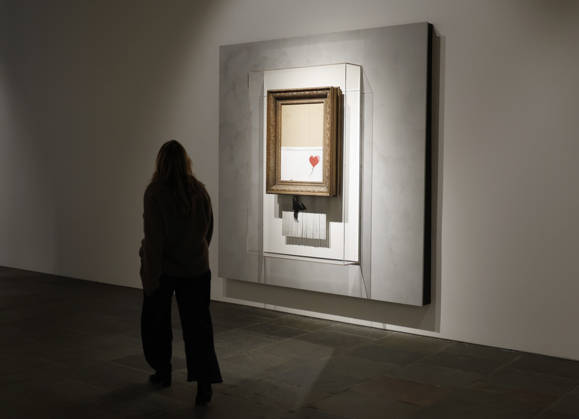 Banksy s Girl without Balloon (2018), the only artwork ever created live in an auction room, is on display at a preview of Icons: Back to Madison at Sotheby s in New York City on Saturday, December 13, 2025. Icons: Back to Madison inaugurates the new global headquarters at the Breuer Building and brings together some of the most iconic works ever sold at Sotheby s.  NYP20251213131 JOHNxANGELILLO