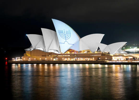 A Hanukkah menorah is projected onto the sails of the Sydney Opera House in memory of the victims of a shooting at Bondi Beach, in Sydney, on Monday on December 15, 2025.  AST2025121506 NSWxPremier sxOffice