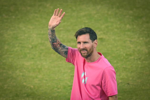 NEW DELHI, INDIA - DECEMBER 15: Lionel Messi, Argentine footballer greets his fans during GOAT India Tour at Arun Jaitley Stadium on December 15, 2025 in New Delhi, India. Lionel Messi concluded his GOAT India Tour in Delhi, a stark contrast to its chaotic Kolkata start. Fans at Arun Jaitley Stadium cheered as the football icon expressed gratitude for the overwhelming affection shown during his brief but memorable visit. Messi promised a return, leaving a lasting impression on his admirers. (Photo by Sanchit Khanna Hindustan Times) GOAT Tour Of India Lionel Messi Felicitated At Arun Jaitley Stadium Delhi