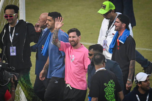 NEW DELHI, INDIA - DECEMBER 15: Lionel Messi, Argentine footballer greets his fans during GOAT India Tour at Arun Jaitley Stadium on December 15, 2025 in New Delhi, India. Lionel Messi concluded his GOAT India Tour in Delhi, a stark contrast to its chaotic Kolkata start. Fans at Arun Jaitley Stadium cheered as the football icon expressed gratitude for the overwhelming affection shown during his brief but memorable visit. Messi promised a return, leaving a lasting impression on his admirers. (Photo by Sanchit Khanna Hindustan Times) GOAT Tour Of India Lionel Messi Felicitated At Arun Jaitley Stadium Delhi