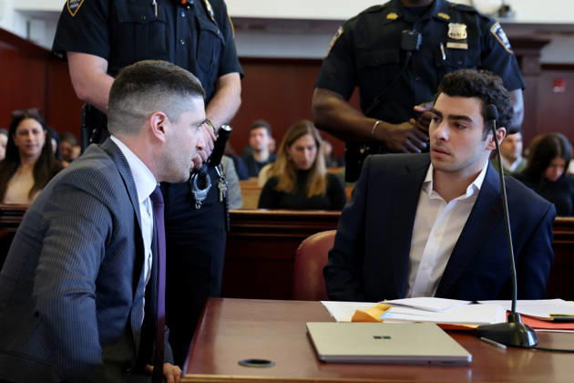 Luigi Mangione confers with his attorney, Jacob Kaplan, as he appears in Manhattan Supreme Court for a suppression hearing in the murder of UHC CEO Brian Thompson on Tuesday, December 18, 2025 in New York City. Pool  NYX20251218111 LuizxC.xRibeiro