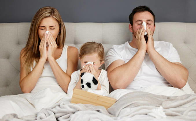 Sick family, bed and blowing nose with tissue for flu, cold or viral infection in isolation together at home. Mother, father and child with fever, sneeze or virus for sinus or influenza in bedroom Sick family, bed and blowing nose with tissue for flu, cold or viral infection in isolation together at home. Mother, father and child with fever, sneeze or virus for sinus or influenza in bedroom., model released, , property released, , 61772570.jpg RECORD DATE NOT STATED