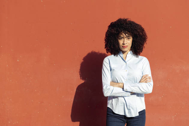 female entrepreneur standing with arms crossed serious ethnic female entrepreneur wearing formal shirt standing with arms crossed looking at camera, model released, , 61998890.jpg RECORD DATE NOT STATED