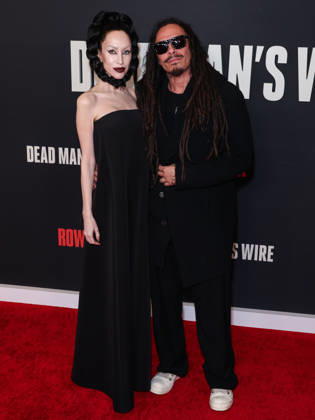 Los Angeles Premiere Of Row K Entertainment s Dead Man s Wire LOS ANGELES, CALIFORNIA, USA - JANUARY 07: Evis Xheneti Shaffer and husband James Shaffer of American nu metal band Korn arrive at the Los Angeles Premiere Of Row K Entertainment s Dead Man s Wire held at AMC The Grove 14 on January 7, 2026 in Los Angeles, California, United States., Credit:Xavier Collin Avalon United States, California, Los Angeles, AMC The Grove 14 Copyright: xXavierxCollinx xAvalonx 1064229817