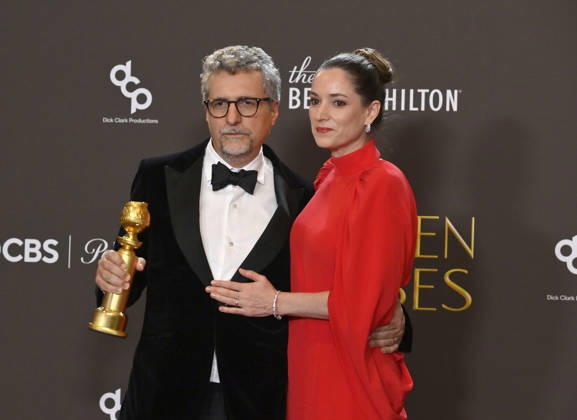 Kleber Mendonça Filho and Emilie Lesclaux appear backstage after winning the award for Best Motion Picture – Non-English Language award for The Secret Agent during the 83rd annual Golden Globe Awards at the Beverly Hilton in Beverly Hills, California on Sunday, January 11, 2026.  LAP20260111712 JIMxRUYMEN