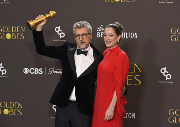 Kleber Mendonça Filho and Emilie Lesclaux appear backstage after winning the award for Best Motion Picture – Non-English Language award for The Secret Agent during the 83rd annual Golden Globe Awards at the Beverly Hilton in Beverly Hills, California on Sunday, January 11, 2026.  LAP20260111713 JIMxRUYMEN