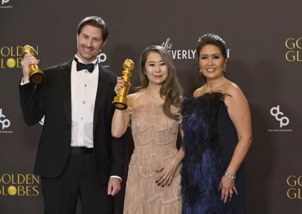 Chris Appelhans, Maggie Kang, and Michelle Wong appear backstage after winning the award for Best Motion Picture - Animated award for KPop Demon Hunters during the 83rd annual Golden Globe Awards at the Beverly Hilton in Beverly Hills, California on Sunday, January 11, 2026.  LAP20260111726 JIMxRUYMEN