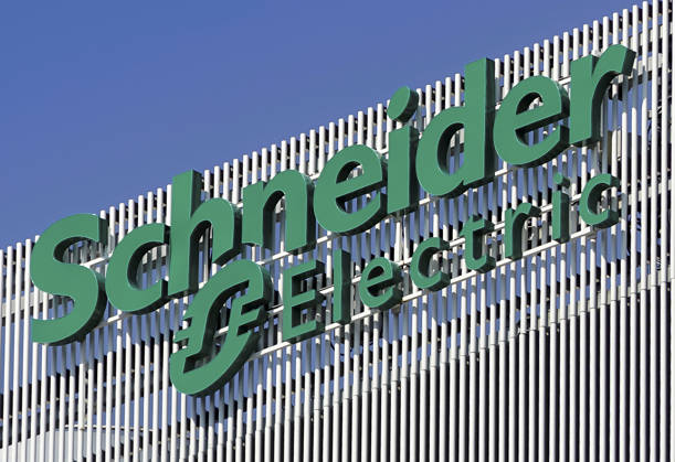 Schneider Electric - Bucharest, Romania Bucharest, Romania - August 16, 2021: A logo of Schneider Electric global specialist in energy management and automation company, is displayed on the top of a building, in Pipera neighborhood. Bucharest Romania Copyright: xLucianxAlecux DSC08650_210816