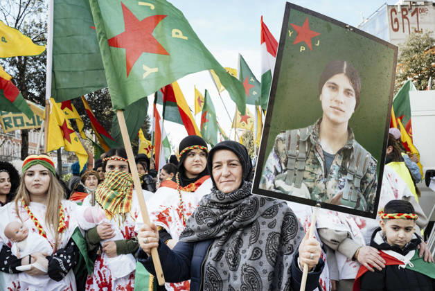Rally in support of the Revolution in Rojava - Toulouse Rally in support of International Solidarity for Rojava asking action against the massacre of the Kurds, in Toulouse, France, on January 31, 2026. A woman in the foreground, Ms. Atac, holding the YPJ flag, Women s Protection Units, in one hand and a poster of a female warrior in the other, with women behind her wearing white dresses stained with blood on their hands, some with babies in their arms. Rally in support of the revolution in Rojava, a semi-autonomous region in northeastern Syria, which is under attack by the new regime seeking to extend its authority over Kurdish-administered territories. Photo by Patricia Huchot-Boissier ABACAPRESS.COM TOULOUSE OCCITANIE France Copyright: xHuchot-BoissierxPatricia ABACAx