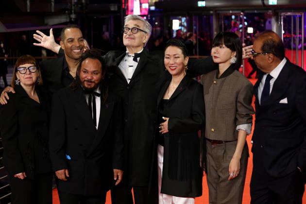 February 12, 2026, Berlin, Germany: International Jury members Shivendra Singh Dungarpur, Min Bahadur Bham, Jury President Wim Wenders, Bae Doona, Hikari, Ewa Puszczynska, and Reinaldo Marcus Green pose on the red carpet at the opening ceremony of the 76th Berlin International Film Festival (Berlinale), which is Europe s first major film festival of the year, in Berlin. The festival runs from February 12 to 22, 2026. Berlin Germany - ZUMAf146 20260212_zip_f146_089 Copyright: xRouzbehxFouladix