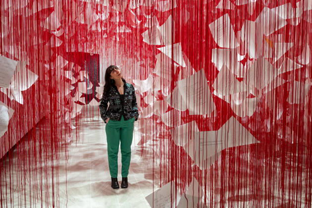 February 16, 2026, London, London, UK: LONDON, UK. A staff member with Ã¢â‚¬ËœLetters of ThanksÃ¢â‚¬â ¢, 2026, at a preview of Chiharu Shiota: Threads of Life, a new exhibition by Japanese performance and installation artist Chiharu Shiota at the Hayward Gallery presenting her iconic floor-to-ceiling weblike works made of red, white and black thread. The show runs 17 February to 3 May 2026. London UK  - ZUMAl94_ 20260216_zaf_l94_011 Copyright: xStephenxChungx