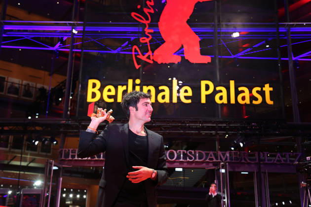 February 21, 2026, Berlin, Germany: German film director and screenwriter Ilker Catak poses with the Golden Bear for Best Film for Gelbe Briefe (Yellow Letters) after the closing ceremony of the 76th Berlin International Film Festival (Berlinale), Europe s first major film festival of the year, in Berlin. The festival runs from February 12 to 22, 2026. Berlin Germany - ZUMAf146 20260221_zip_f146_003 Copyright: xRouzbehxFouladix