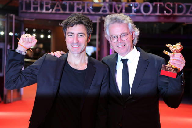 February 21, 2026, Berlin, Germany: German film director and screenwriter Ilker Catak (L) and Movie producer Ingo Fliess pose with the Golden Bear for Best Film for Gelbe Briefe (Yellow Letters) after the closing ceremony of the 76th Berlin International Film Festival (Berlinale), Europe s first major film festival of the year, in Berlin. The festival runs from February 12 to 22, 2026. Berlin Germany - ZUMAf146 20260221_zip_f146_005 Copyright: xRouzbehxFouladix
