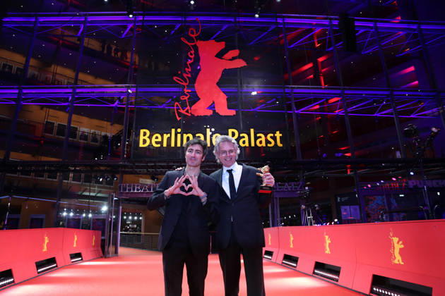 February 21, 2026, Berlin, Germany: German film director and screenwriter Ilker Catak (L) and Movie producer Ingo Fliess pose with the Golden Bear for Best Film for Gelbe Briefe (Yellow Letters) after the closing ceremony of the 76th Berlin International Film Festival (Berlinale), Europe s first major film festival of the year, in Berlin. The festival runs from February 12 to 22, 2026. Berlin Germany  - ZUMAf146 20260221_zip_f146_006 Copyright: xRouzbehxFouladix