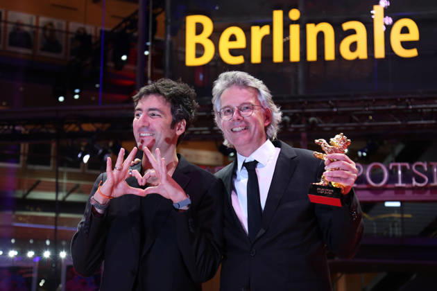 February 21, 2026, Berlin, Germany: German film director and screenwriter Ilker Catak (L) and Movie producer Ingo Fliess pose with the Golden Bear for Best Film for Gelbe Briefe (Yellow Letters) after the closing ceremony of the 76th Berlin International Film Festival (Berlinale), Europe s first major film festival of the year, in Berlin. The festival runs from February 12 to 22, 2026. Berlin Germany - ZUMAf146 20260221_zip_f146_010 Copyright: xRouzbehxFouladix