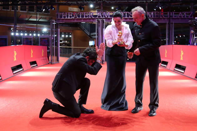 February 21, 2026, Berlin, Germany: (L-R) Ilker Catak, Ozgu Namal, and Tansu Bicer pose with the Golden Bear for Best Film for Gelbe Briefe (Yellow Letters) after the closing ceremony of the 76th Berlin International Film Festival (Berlinale), Europe s first major film festival of the year, in Berlin. The festival runs from February 12 to 22, 2026. Berlin Germany - ZUMAf146 20260221_zip_f146_016 Copyright: xRouzbehxFouladix