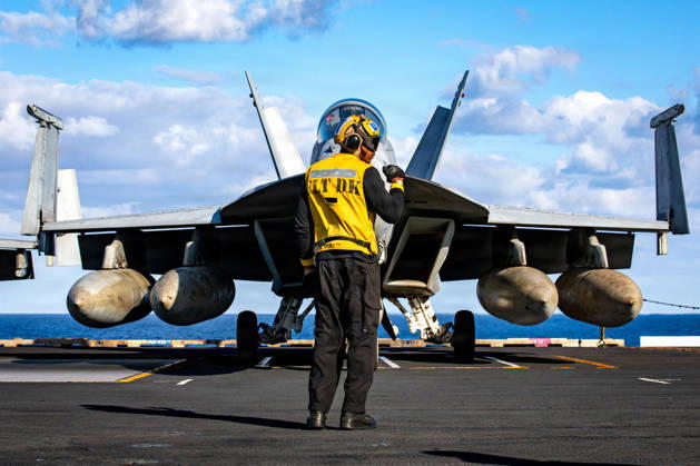News Themen der Woche KW09 March 1, 2026, Uss Gerald R Ford, International Waters: A U.S. Navy sailor signals a F A-18F Super Hornet aircraft, attached to the Tomcatters of Strike Fighter Squadron 31, to hold during taxi on the flight deck of the Ford-class aircraft carrier USS Gerald R. Ford operating in support of Operation Epic Fury, February 28, 2025, in an undisclosed location. Operation Epic Fury is the joint U.S-Israel attack on Iran. Uss Gerald R Ford International Waters - ZUMAp138 20260301_zaa_p138_056 Copyright: xUsxNavy U.SxNavyx