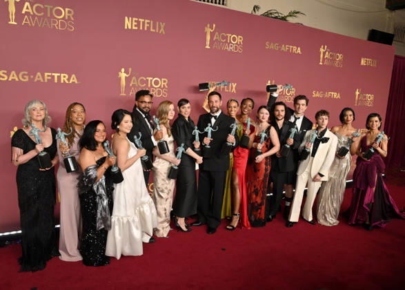 Joanna Going, Krystel V. McNeil, Tracy Vilar, Kristin Villanueva, Brandon Mendez Homer, Taylor Dearden, Fiona Dourif, Noah Wyle, Alexandra Metz, Tracy Ifeachor, Isa Briones, Jalen Thomas Brooks, Patrick Ball, Gerran Howell, Supriya Ganesh and Amielynn Abellera, winners of the Outstanding Performance by an Ensemble in a Drama Series award for The Pitt, appear backstage during the 32nd annual SAG Awards held at the Shrine Auditorium in Los Angeles on Sunday, March 1, 2026.  LAP20260301169 JIMxRUYMEN