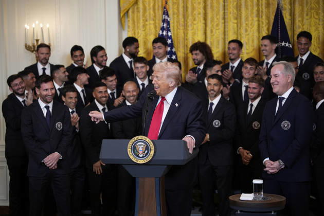 US President Donald Trump talks with captain Lionel Messi alongside members of Major League Soccer (MLS) champions Inter Miami CF during an event in the East Room of the White House on Thursday, March 5, 2026 in Washington, DC.  WAX20260305903 YurixGripas
