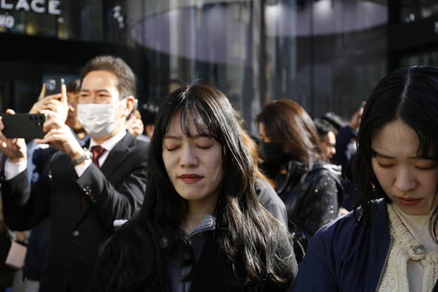 March 11, 2026, Tokyo, Japan: People pray during a moment of silence at 2:46 pm for the victims of the Great East Japan Earthquake-Tsunami and nuclear disaster outside the WAKO department store in Ginza. This year marked 15 years since an earthquake and tsunami disaster that killed thousands and led to the Fukushima nuclear crisis. Tokyo Japan - ZUMAm191 20260311_aap_m191_003 Copyright: xRodrigoxReyesxMarinx
