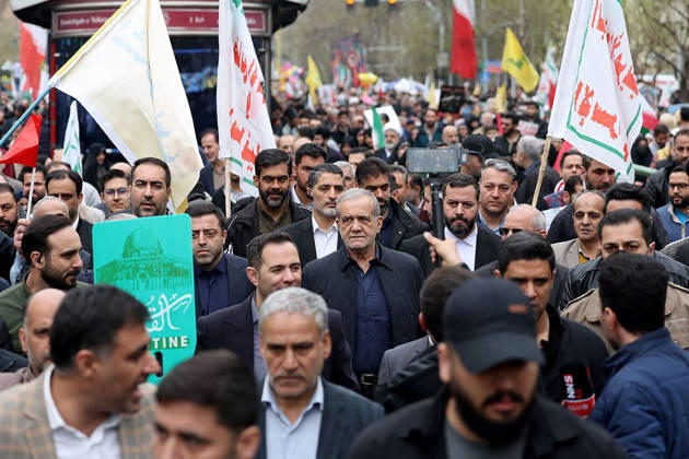 Iranian President Masoud Pezeshkian (C) participates in the traditional Quds Day rally in the capital Tehran, on Friday on March 13, 2026. Thousands of Iranians took to the streets of the capital on Friday to mark Quds Day, an annual event held in support of the Palestinian cause. Established in 1979, Quds Day is traditionally observed on the last Friday of Ramadan.This year s demonstration unfolded against the backdrop of the continuing war between Iran, the United States, and Israel, adding heightened political significance to the occasion.  IRN2026031306 IslamicxRepublicxNewsxAgencyxIRN