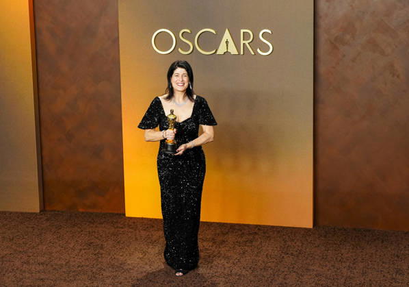 Cassandra Kulukundis celebrates in the press photo room after winning the Best Casting Oscar for One Battle After Another during the 98th annual Academy Awards in the Hollywood section of Los Angeles on Sunday, March 15, 2026. Conan O Brien is hosting the Oscars for the second consecutive year. LAP20260315332 BONNIExCASH