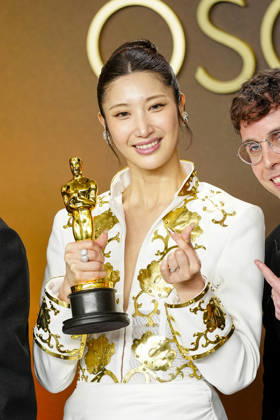 EJAE, Mark Sonnenblick, Joong Gyu Kwak, Yu Han Lee, Hee Dong Nam, Jeong Hoon Seo, and Teddy Park celebrate in the press photo room after winning the Best Original Song Oscar for Golden from KPop Demon Hunters during the 98th annual Academy Awards in the Hollywood section of Los Angeles on Sunday, March 15, 2026.  LAP20260315396 BONNIExCASH