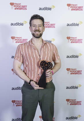 March 16, 2026: Austin, Texas. 2026 IHeartPodcast Awards, winners pose with their awards.Zachary Grady, wirter director, winner for Best Fiction, Murder at the Patel Motel. - ZUMAda1_ 20260316_zap_da1_088 Copyright: xSandraxDahdahx