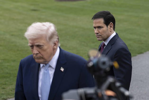 March 20, 2026, Washington, District Of Columbia, United States: U.S. Secretary of State Marco Rubio looks on as U.S. President Donald Trump speaks to journalists before departing the White House on March 20, 2026, in Washington D.C. President Trump is traveling to Florida to spend the weekend at his Mar-a-Lago resort. Washington United States - ZUMAe119 20260320_znp_e119_006 Copyright: xMehmetxEserx