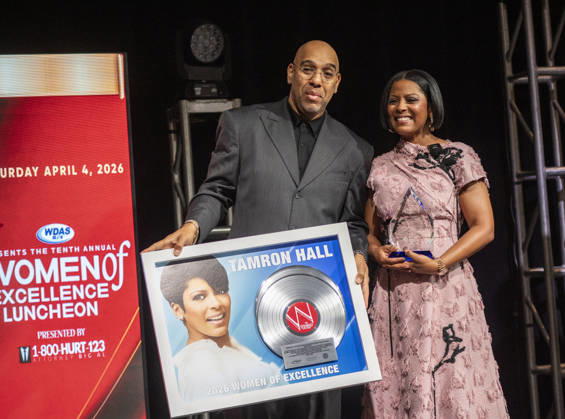 April 4, 2026, Philadelphia, Pennsylvania, United States: DERRICK CORBETT, Senior Vice President of Programming for iHeartMedia holds an award to present to TAMRON HALL, American broadcast journalist, television talk show host and author, receives the WDAS-FM tenth annual Women Of Excellence Legend award at the luncheon held at the Philadelphia Sheraton Philadelphia United States - ZUMArf1_ 20260404_zaf_rf1_029 Copyright: xRickyxFitchettx