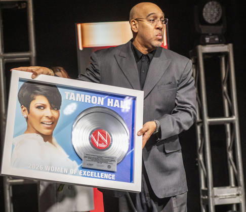 April 4, 2026, Philadelphia, Pennsylvania, United States: DERRICK CORBETT, Senior Vice President of Programming for iHeartMedia holds an award to present to TAMRON HALL, American broadcast journalist, television talk show host and author, receives the WDAS-FM tenth annual Women Of Excellence Legend award at the luncheon held at the Philadelphia Sheraton Philadelphia United States - ZUMArf1_ 20260404_zaf_rf1_026 Copyright: xRickyxFitchettx