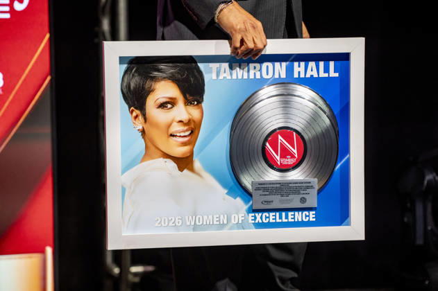 April 4, 2026, Philadelphia, Pennsylvania, United States: DERRICK CORBETT, Senior Vice President of Programming for iHeartMedia holds an award to present to TAMRON HALL, American broadcast journalist, television talk show host and author, receives the WDAS-FM tenth annual Women Of Excellence Legend award at the luncheon held at the Philadelphia Sheraton Philadelphia United States - ZUMArf1_ 20260404_zaf_rf1_031 Copyright: xRickyxFitchettx
